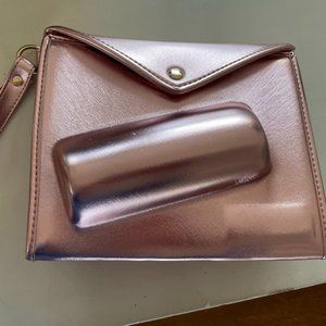 Rose gold colored can clutch by 8 Oak Lane for Neiman Marcus